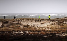 BABYLON, NY - APRIL 05: Suffolk County Police and police recruits search an area of beach near where police recently found human remains on April 5, 2011 in Babylon, New York. Working on the theory of a single serial killer may be working in the New York area, the police found three additional sets of human remains Monday, bringing the total number of bodies found in the area to eight. It is believed that most of the remains are female and that some of the women were working as prostitutes. Currently the police have no suspects in the crimes. (Photo by Spencer Platt/Getty Images)